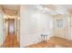 Hallway featuring light wood floors, bright walls, and classic doors with nice trim at 2601 Round Ridge Rd, Loganville, GA 30052