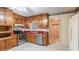 Well-maintained kitchen with wood cabinets, stainless steel appliances, and durable countertops at 2601 Round Ridge Rd, Loganville, GA 30052