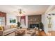 Comfortable living room with a brick fireplace, plush seating, and plenty of natural light at 2601 Round Ridge Rd, Loganville, GA 30052