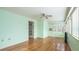 Inviting sunroom featuring wood floors, soft paint color, and ample natural light at 2601 Round Ridge Rd, Loganville, GA 30052