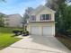 Charming two-story home featuring a two-car garage and manicured landscaping at 3227 Diamond Blf, Union City, GA 30291