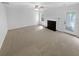 Large living area with cozy fireplace and neutral carpet, ready for personalization at 3227 Diamond Blf, Union City, GA 30291