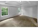 Main bedroom with trey ceiling and two windows at 3227 Diamond Blf, Union City, GA 30291