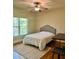 Bright bedroom featuring hardwood floors and a comfortable bed at 89 Grand Oak Way, Dallas, GA 30157