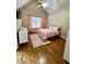 Spacious bedroom with hardwood floors and pink accents at 89 Grand Oak Way, Dallas, GA 30157
