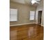Spacious bedroom with hardwood floors and two windows at 89 Grand Oak Way, Dallas, GA 30157