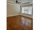 Spacious bedroom with hardwood floors and a large window at 89 Grand Oak Way, Dallas, GA 30157
