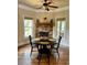 Cozy dining area with a stone fireplace and hardwood floors at 89 Grand Oak Way, Dallas, GA 30157