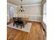 Bright dining room with hardwood floors and a chandelier at 89 Grand Oak Way, Dallas, GA 30157