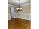 Formal dining room featuring hardwood floors and a chandelier at 89 Grand Oak Way, Dallas, GA 30157