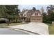 Two-story house with a large front yard, attached two-car garage, and covered porch at 89 Grand Oak Way, Dallas, GA 30157