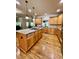 Open concept kitchen with hardwood floors and an island at 89 Grand Oak Way, Dallas, GA 30157