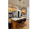 Kitchen island with granite countertops and stainless steel appliances at 89 Grand Oak Way, Dallas, GA 30157