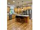 Spacious kitchen with an island, stainless steel appliances, and hardwood floors at 89 Grand Oak Way, Dallas, GA 30157