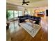 Open living area with hardwood floors and a large sectional sofa at 89 Grand Oak Way, Dallas, GA 30157