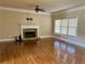 Living room with hardwood floors, fireplace and large window at 89 Grand Oak Way, Dallas, GA 30157