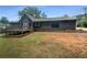Charming home featuring a deck and a spacious yard perfect for outdoor activities and relaxation at 3551 Mill Glen Dr, Douglasville, GA 30135