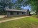 Attractive home featuring a well-manicured lawn and a welcoming facade with lots of natural light at 3551 Mill Glen Dr, Douglasville, GA 30135