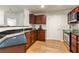 Modern kitchen with dark wood cabinets and granite countertops at 390 17Th Nw St # 1063, Atlanta, GA 30363