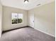 Inviting bedroom space with a neutral color palette and ample natural light at 277 Players Cir, Fayetteville, GA 30215