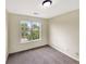 Cozy bedroom with natural light streaming through the large window at 277 Players Cir, Fayetteville, GA 30215