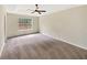 Generous carpeted bedroom with natural light and space for personalized décor at 277 Players Cir, Fayetteville, GA 30215