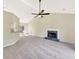 Bright living room with a vaulted ceiling, ceiling fan, and a modern fireplace at 277 Players Cir, Fayetteville, GA 30215