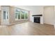 Bright living room featuring a modern fireplace and large windows for natural light at 5210 Ginger Rose Ct, Cumming, GA 30028