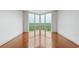 Bright bedroom with hardwood floors and large windows offering scenic views at 2870 Pharr Court South Nw # 2407, Atlanta, GA 30305