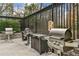 Outdoor grilling area with multiple grills and stone countertops at 2870 Pharr Court South Nw # 2407, Atlanta, GA 30305