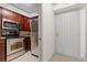Modern kitchen features stainless steel appliances and wood cabinets at 2870 Pharr Court South Nw # 2407, Atlanta, GA 30305