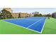 Blue tennis court with green surrounding at 2870 Pharr Court South Nw # 2407, Atlanta, GA 30305