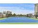 Blue tennis court with green surrounding at 2870 Pharr Court South Nw # 2407, Atlanta, GA 30305