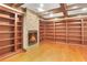 Finished library with hardwood floors, built-in shelving, and stone fireplace at 4002 Moheb Sw St, Atlanta, GA 30331