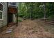 Spacious backyard with a wooden deck and a partially fenced area at 7655 Abbey Glen Dr, Cumming, GA 30028