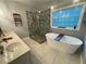 Elegant bathroom with double vanity, soaking tub, and walk-in shower at 7655 Abbey Glen Dr, Cumming, GA 30028