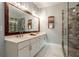 Bathroom boasts double vanity, walk-in shower, and large mirror at 7655 Abbey Glen Dr, Cumming, GA 30028