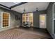 Covered deck with a dining set, offering a relaxing outdoor space at 7655 Abbey Glen Dr, Cumming, GA 30028