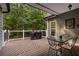 Spacious deck with a grill and seating area, perfect for entertaining at 7655 Abbey Glen Dr, Cumming, GA 30028