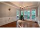 Bright dining room featuring hardwood floors and ample natural light at 7655 Abbey Glen Dr, Cumming, GA 30028