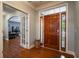 Bright entryway with hardwood floors and view into living room at 7655 Abbey Glen Dr, Cumming, GA 30028