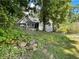 Lovely house exterior nestled on a hillside with lush landscaping at 7655 Abbey Glen Dr, Cumming, GA 30028