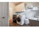 Laundry room with washer, dryer, and utility sink at 7655 Abbey Glen Dr, Cumming, GA 30028