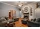 Bright living room featuring hardwood floors and a cozy seating area at 7655 Abbey Glen Dr, Cumming, GA 30028