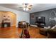 Open living space with hardwood floors and an entertainment center at 7655 Abbey Glen Dr, Cumming, GA 30028