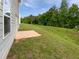 Sloped backyard with patio at 55 Cherohala Ct, Covington, GA 30016