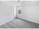 Neutral bedroom featuring natural light, plush carpet and a ceiling fan at 55 Cherohala Ct, Covington, GA 30016