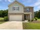 Charming two-story home with brick and siding, plus an attached garage at 55 Cherohala Ct, Covington, GA 30016