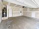 Attached garage with unfinished drywall and water heater at 55 Cherohala Ct, Covington, GA 30016