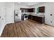 Spacious kitchen with stainless steel appliances, ample storage, and dark cabinets at 55 Cherohala Ct, Covington, GA 30016
